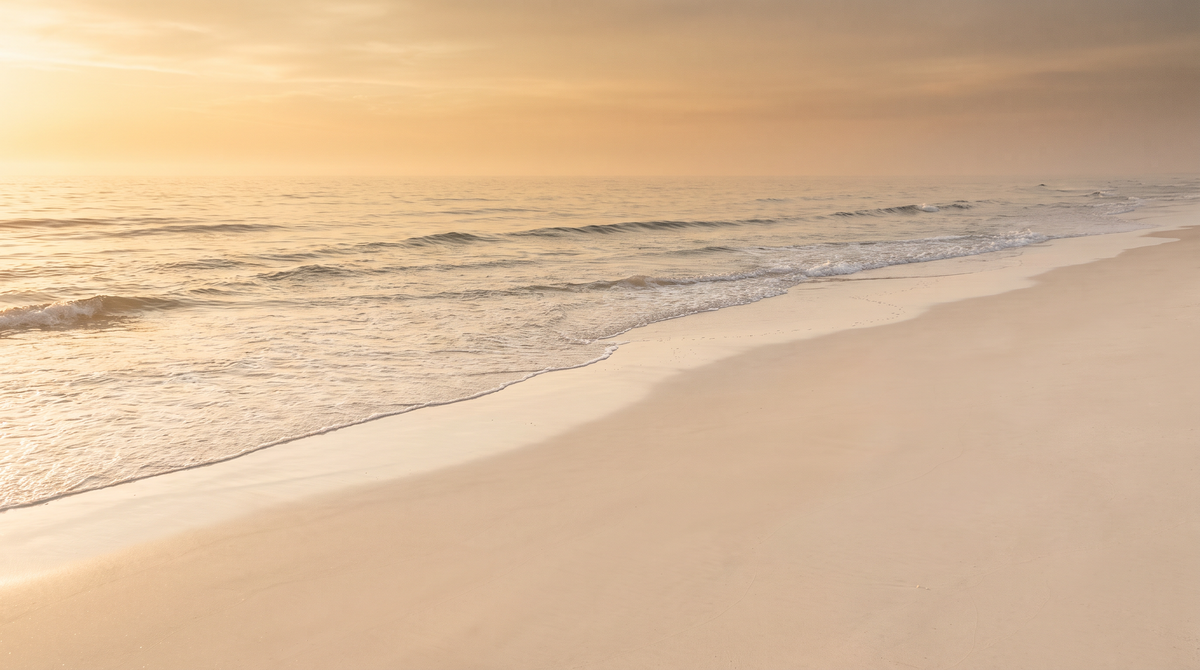 Quiet ocean shoreline at golden hour